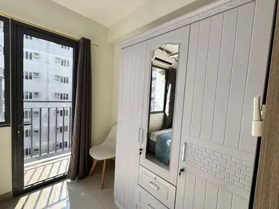 a room with a door and a window with a view at Room 1469 Shore 2 Residences Near Airport, MOA by Prime Stay MOA in Manila