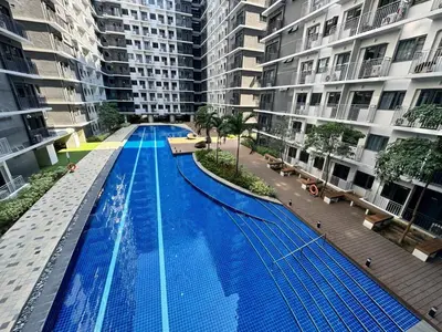 an overhead view of a large swimming pool in a building at Shore 3 Residences Poolside Room 245 by Prime Stay MOA in Manila