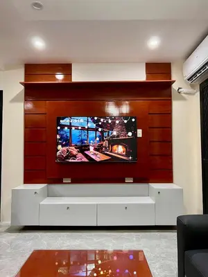 a living room with a flat screen tv on a wall at Apartment Taguig Makati staycation with parking in Manila