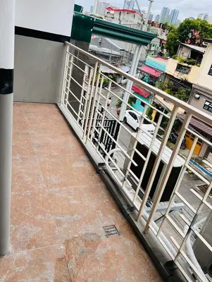 a balcony with a metal railing on a building at Apartment Taguig Makati staycation with parking in Manila
