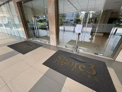 a lobby with two welcome mats in front of a store at Room 1691 Shore 3 Residences infront of SM MOA by Prime Stay in Manila
