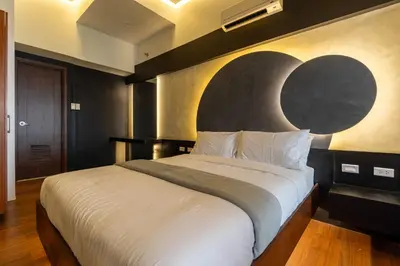 a bedroom with a large bed with a moon painted on the wall at Stunning View Loft Type 1 BR in Circulo Verde near Bridgetowne, Eastwood Fast Wi-Fi in Manila