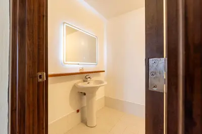 a bathroom with a sink and a mirror at Stunning View Loft Type 1 BR in Circulo Verde near Bridgetowne, Eastwood Fast Wi-Fi in Manila