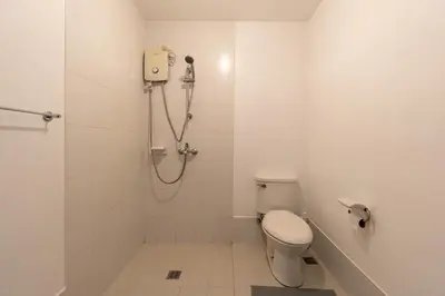 a bathroom with a shower and a toilet at Stunning View Loft Type 1 BR in Circulo Verde near Bridgetowne, Eastwood Fast Wi-Fi in Manila