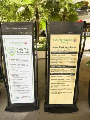 two signs sitting on a sidewalk next to a sidx sidx sidx at JFam Suites, C2-5F 1BR , Up To 6 Pax in Biñan