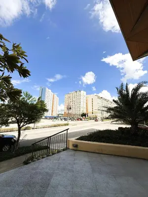 a view of a city with tall buildings and a street at JFam Suites, C2-5F 1BR , Up To 6 Pax in Biñan