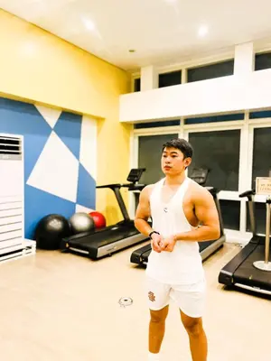 a man is standing in a gym at JFam Suites, C2-5F 1BR , Up To 6 Pax in Biñan