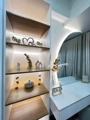 a room with wooden shelves and a table at Luxe 1BR Condo - Near BGC & Venice Grand Canal in Manila