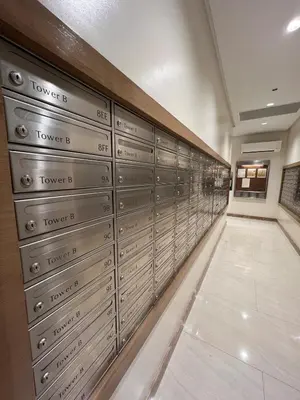 a row of lockers in a room with a hallway at Luxe 1BR Condo - Near BGC & Venice Grand Canal in Manila