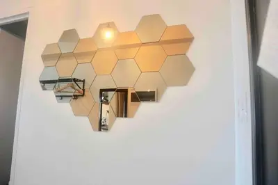 a wall with a heart shaped design on a wall at Captivating Crib in the Metro in Manila