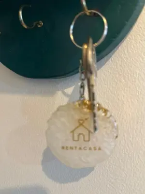 a key chain with a house on it at Captivating Crib in the Metro in Manila