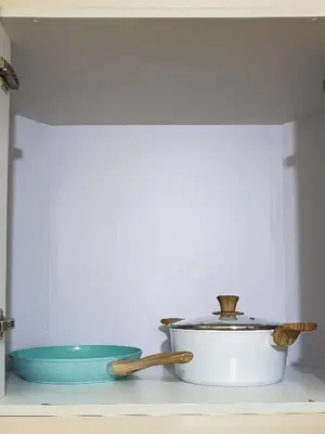 a pot and a bowl sitting on top of a shelf at Layover Stay Condotels at Two Palm Tree Villas in Manila