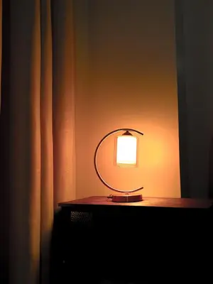 a light on top of a table in a room at Layover Stay Condotels at Two Palm Tree Villas in Manila