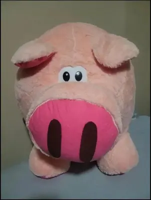 a pink teddy bear with eyes and eyebrows at Ailyn in Manila