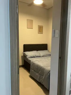 a bedroom with a bed in a small room at The Calm Corner - S Residences Tower 2 in Manila