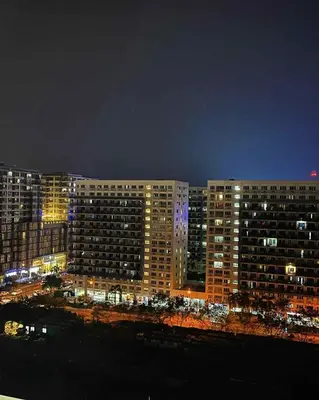 a view of a city at night with buildings at The Calm Corner - S Residences Tower 2 in Manila