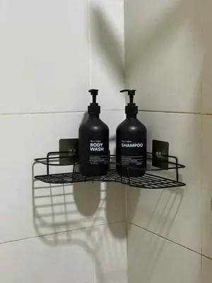 two bottles of soap on a shelf on a wall at The Calm Corner - S Residences Tower 2 in Manila