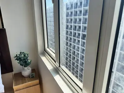 a room with a window with a potted plant at Sunny side Cityscape C2 RM 1716 Shore Residences by Prime Stay MOA in Manila
