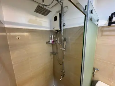 a shower in a bathroom with a glass door at Sunny side Cityscape C2 RM 1716 Shore Residences by Prime Stay MOA in Manila