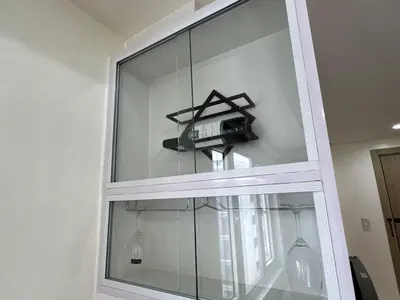 a glass window with a camera in it at Sunny side Cityscape C2 RM 1716 Shore Residences by Prime Stay MOA in Manila