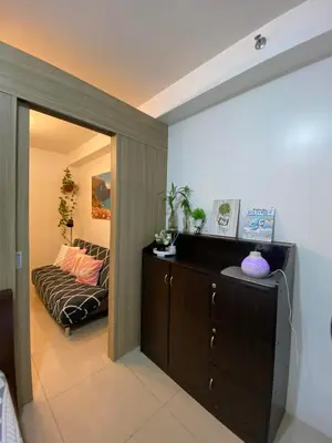 a living room with a couch in a room at Haven's Suites a place like home in Manila
