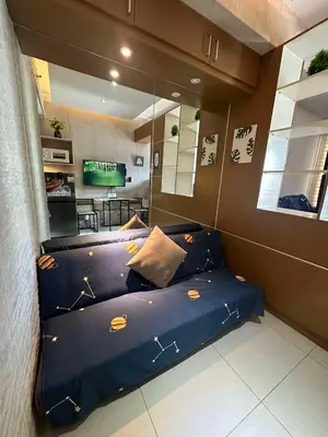 a bedroom with a blue bed with stars on it at Jeric Place Staycation in Manila