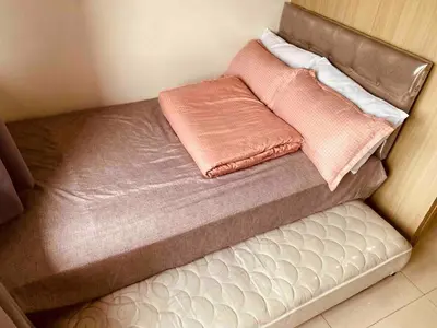 a small bed with two pink towels on it at Mall of Asia Netflix Disney WIFI IKEA ARENA NAIA SHORE2 418 in Manila
