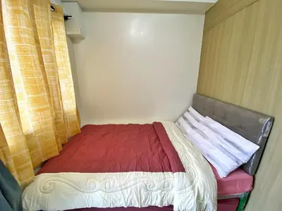 a small bed in a small room with a window at Mall of Asia Netflix Disney WIFI IKEA ARENA NAIA SHORE2 418 in Manila