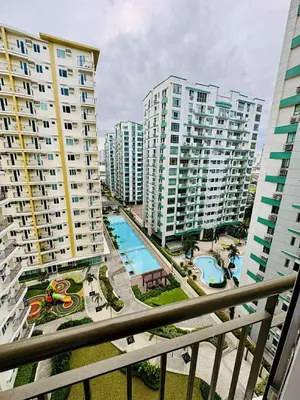 an aerial view of a city with tall buildings at Jolgeous Staycations and Rentals in Manila