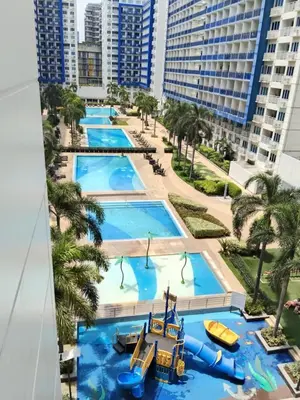 an overhead view of a pool with a water park at Lhan residence in Manila
