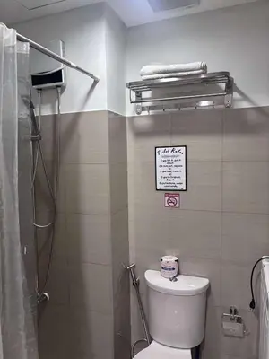 a bathroom with a toilet and a shower in it at Shore 2 Tower 1 MOA MallofAsia ARENA IKEA NAIA 685 in Manila