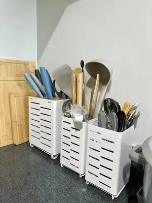 two white containers filled with utensils at New Cozy 2-bedroom deluxe condo for 5 pax in MOA in Manila