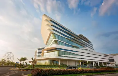 a large office building with a lot of windows at Conrad Manila in Manila