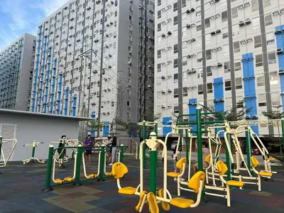 a playground in front of a large building at Enzo vibes in Manila