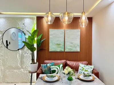 a dining room with a table and a mirror at 1-Bedroom Cozy Haven Sorrento Oasis in Manila