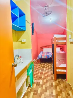 a room with a sink and a room with bunk beds at Solano Transient House in Manila