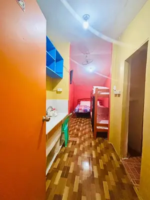 a room with colorful walls and a hallway with a door at Solano Transient House in Manila