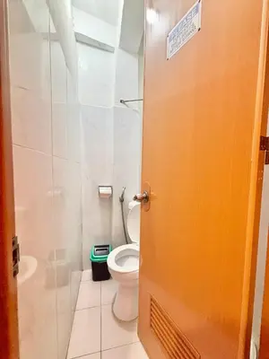 an open door to a bathroom with a toilet at Solano Transient House in Manila