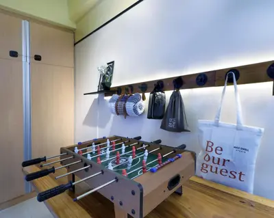 a room with a foosball game on the wall at Starwars Retreat Gaming & 84 inch Movie & Near Mall in Manila
