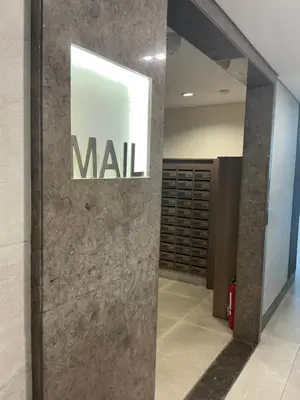a wall with a sign on it in a lobby at Green 2 Residences Tower 2 Petes Place in Dasmariñas