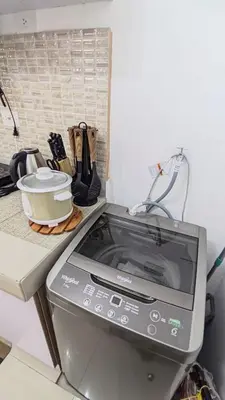 a counter with a stove with a pot on it at Green 2 Residences Tower 2 Petes Place in Dasmariñas
