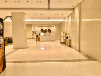 a lobby of a building with a store at NAIA 101 Condotel Newport Luxe Stay Pasay in Manila