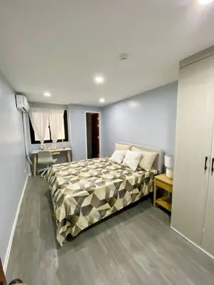a bedroom with a large bed in a room at House in Makati, Poblacion in Manila