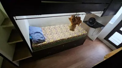an overhead view of a bed in a room at Nemar Ladies Dormitel in Manila