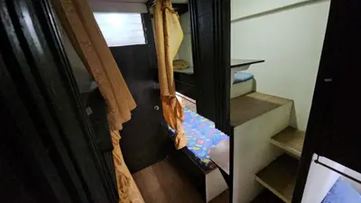 an open door of a room with a staircase in a house at Nemar Ladies Dormitel in Manila