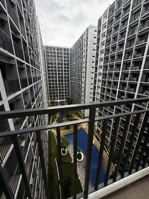 a view of two apartment buildings from a balcony at Cozy MOA Condo Perfect for 2 in Manila