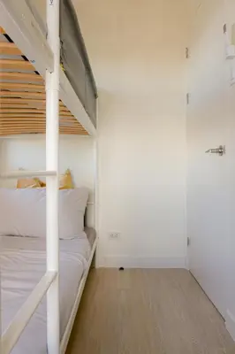 a bedroom with a bunk bed with a ladder at Aston Residences 2BR in Pasay-up to 6pax in Manila