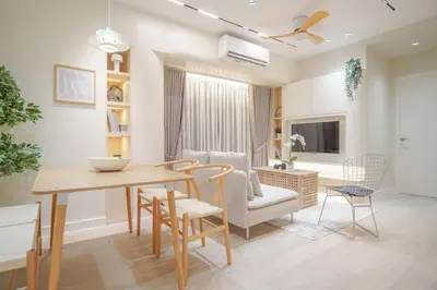 a dining room and living room with a table and chairs at Aston Residences 2BR in Pasay-up to 6pax in Manila