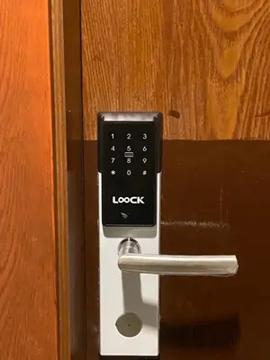 a remote control sticking out of a door at 1BR- Axinite walking distance to MOA, PICC, SMX, Worldtrade near NAIA and Star City in Manila
