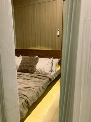 a bed with two pillows on it in a room at condo near MOA&NAIA&Bay, full length mirror&balcony in Manila